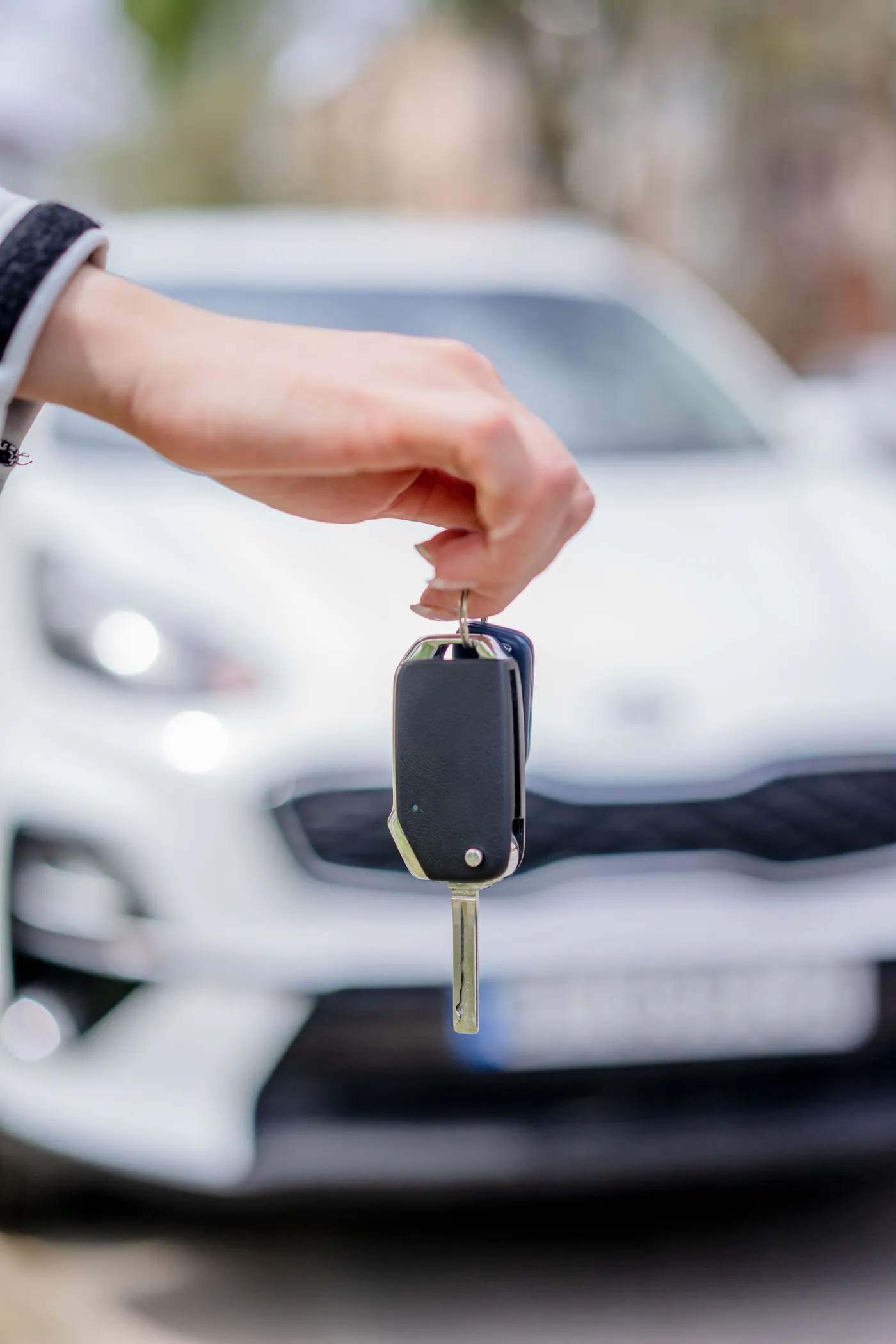 Premium vehicle key handoff for private transportation